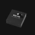 Truthear Keyx multi-injection molded construction with CNC anodized metal shell showing compact dongle form factor for IEM use