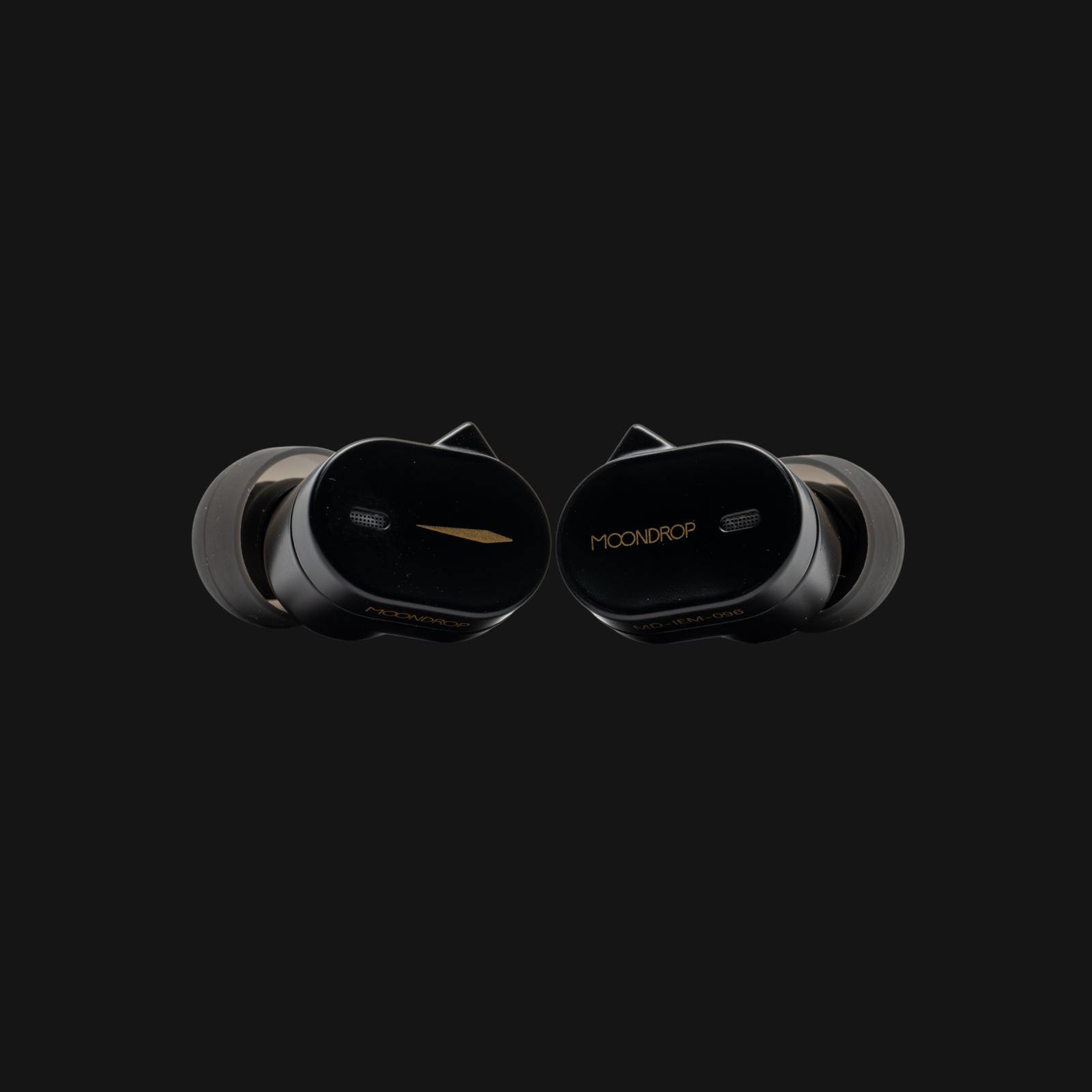 Moondrop CHU III earphones in black with a black metal finish, gold accents and silicone ear tips on a black background.